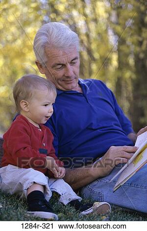 people, reading, book, outdoors, family, grandfather, grandchild View Large Photo Image Stock Image - people, reading, book, outdoors, family, grandfather, grandchild. Fotosearch