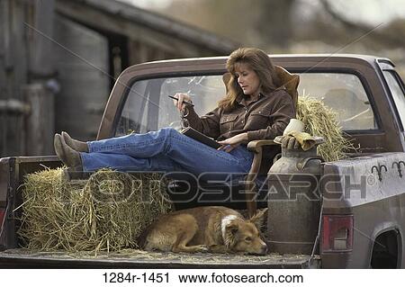 people, relaxation, woman, dog, hay, reading View Large Photo Image Stock Image - people, relaxation, woman, dog, hay, reading. Fotosearch