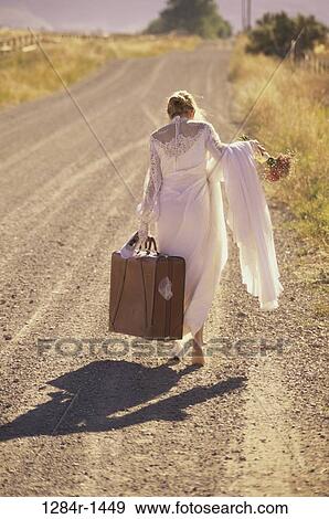 Stock Photo - people, road, walking, luggage, future, wedding, bouquet. Fotosearch