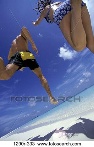 people, running, couple, beach, Caucasian, run View Large Photo Image Stock Image - people, running, couple, beach, Caucasian, run. Fotosearch