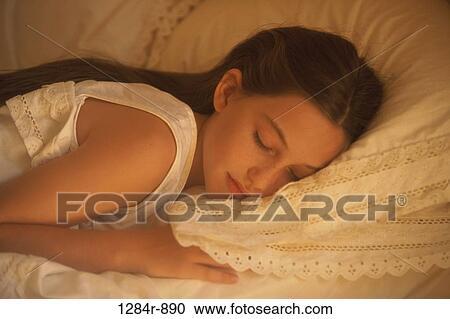 Stock Image - people, sleeping, bed, girl, brunette, asleep. Fotosearch