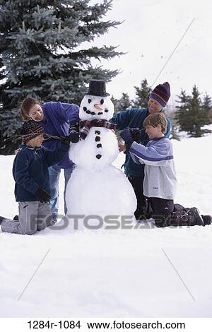people, snow, building, mother, winter, carrot, outdoors View Large Photo Image Picture - people, snow, building, mother, winter, carrot, outdoors. Fotosearch