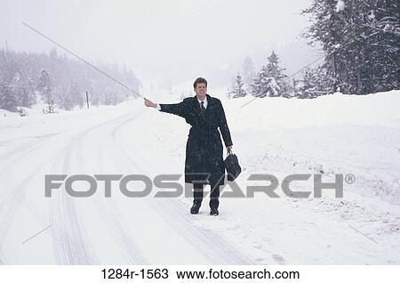 Stock Image - people, snow, road, winter, snowy. Fotosearch