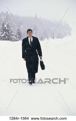 Picture - people, snow, walking, winter, snowy, business. Fotosearch