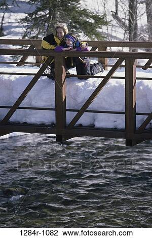 people, snow, water, mother, winter, bridge, outdoors View Large Photo Image Stock Image - people, snow, water, mother, winter, bridge, outdoors. Fotosearch