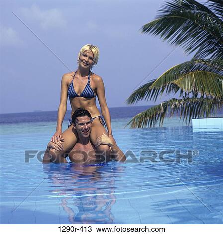 Stock Image - people, swim, pool, couple, swimming, beach. Fotosearch