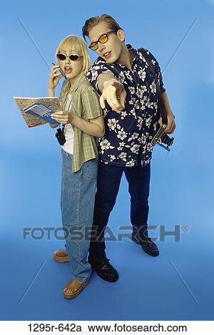 people, talking, couple, phone, sunglasses, pointing, point View Large Photo Image Stock Image - people, talking, couple, phone, sunglasses, pointing, point. Fotosearch