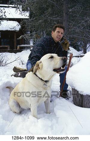 Stock Photo - people, telephone, dog, talking, winter, phone. Fotosearch