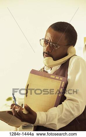 Stock Image - people, telephone, talking, eyeglasses, busy, overwhelmed. Fotosearch
