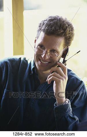Stock Image - people, telephone, talking, eyeglasses, phone, Middle-aged. Fotosearch