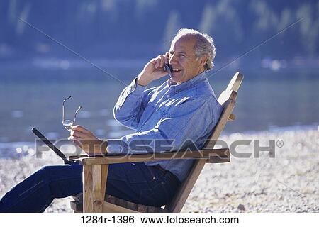 Stock Photograph - people, telephone, talking, eyeglasses, chair. Fotosearch