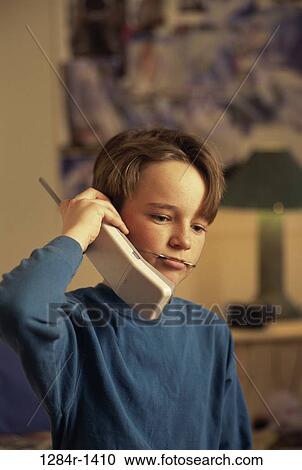 Stock Image - people, telephone, talking, phone, boy, child, brunette. Fotosearch