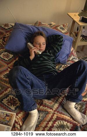 people, telephone, talking, pillow, phone, bed, boy View Large Photo Image Stock Photo - people, telephone, talking, pillow, phone, bed, boy. Fotosearch