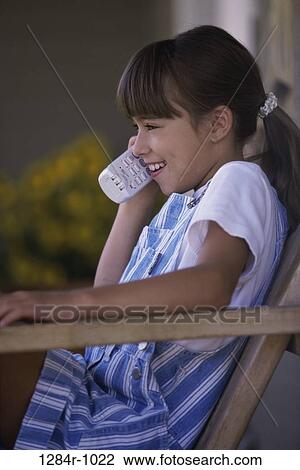 people, telephone, talking, sitting, Hispanic, phone, girl View Large Photo Image Stock Image - people, telephone, talking, sitting, Hispanic, phone, girl. Fotosearch