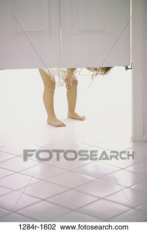 Stock Image - people, toddler, girl, legs, child, peeking. Fotosearch