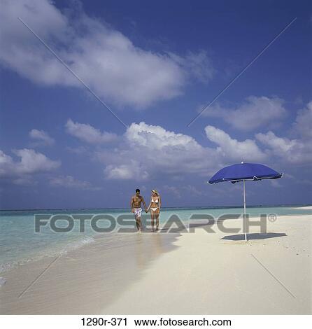 people, umbrella, walking, couple, beach View Large Photo Image Stock Image - people, umbrella, walking, couple, beach. Fotosearch