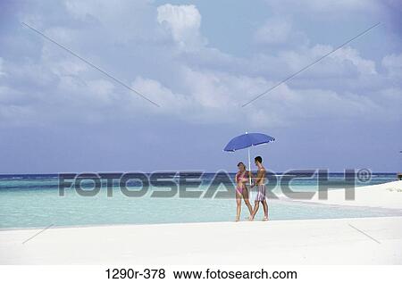 people, umbrella, walking, couple, beach, walk View Large Photo Image Stock Photo - people, umbrella, walking, couple, beach, walk. Fotosearch