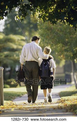 people, walking, backpack, outdoors, family, sidewalk View Large Photo Image Stock Image - people, walking, backpack, outdoors, family, sidewalk. Fotosearch