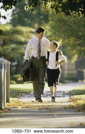 people, walking, backpack, outdoors, family, sidewalk View Large Photo Image Stock Image - people, walking, backpack, outdoors, family, sidewalk. Fotosearch