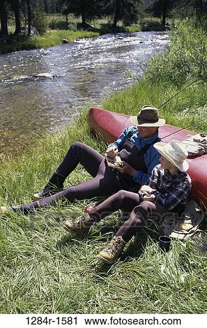 people, water, canoe, resting, family, father View Large Photo Image Stock Image - people, water, canoe, resting, family, father. Fotosearch