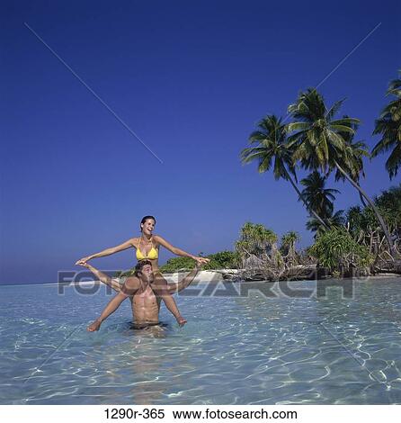 people, water, couple, beach, Caucasian View Large Photo Image Stock Photography - people, water, couple, beach, Caucasian. Fotosearch