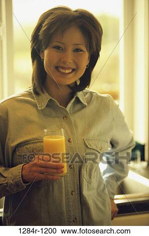 people, woman, Asian, orange juice, drinking, food, juice View Large Photo Image Stock Image - people, woman, Asian, orange juice, drinking, food, juice. Fotosearch