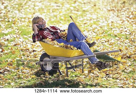 people, woman, autumn, telephone, talking, sitting View Large Photo Image Picture - people, woman, autumn, telephone, talking, sitting. Fotosearch
