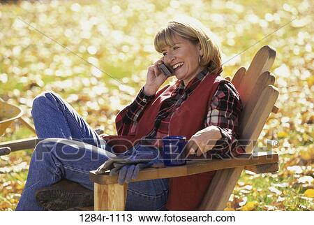 people, woman, autumn, telephone, talking, chair View Large Photo Image Stock Image - people, woman, autumn, telephone, talking, chair. Fotosearch