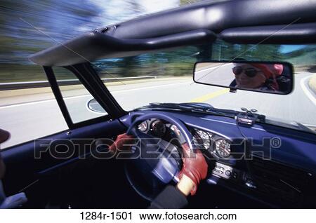 Stock Image - people, woman, car, driving, convertible, transportation. Fotosearch