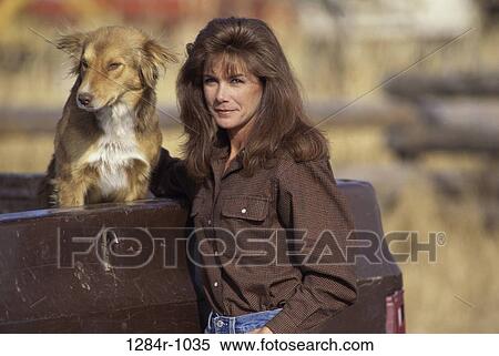 Stock Photography - people, woman, dog, pet, outdoors, Middle-aged. Fotosearch