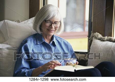 Stock Photo - people, woman, eyeglasses, coffee, senior, mug. Fotosearch