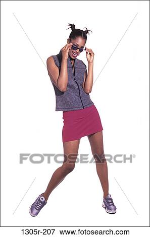 Stock Photo - people, woman, smiling, sunglasses, smile, posing, brunette. Fotosearch