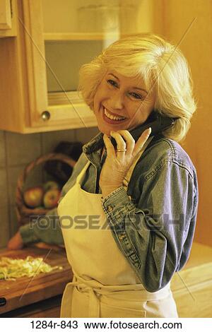 Stock Image - people, woman, smiling, telephone, talking, senior, phone. Fotosearch