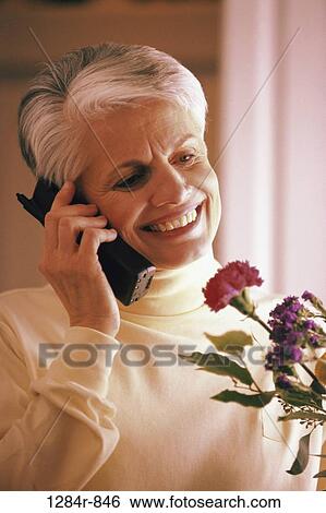 Stock Photograph - people, woman, smiling, telephone, talking, senior, phone. Fotosearch