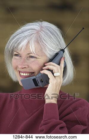 Picture - people, woman, telephone, talking, phone, ring, cell. Fotosearch