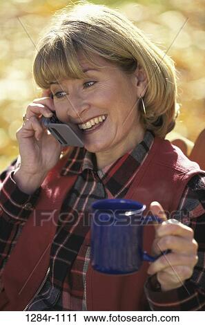 people, woman, telephone, talking, phone, outdoors, Middle-aged View Large Photo Image Stock Image - people, woman, telephone, talking, phone, outdoors, Middle-aged. Fotosearch