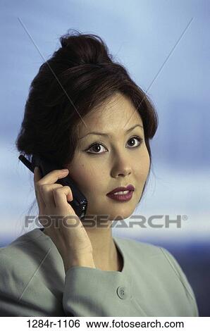Stock Photograph - people, woman, telephone, talking, Asian, phone. Fotosearch