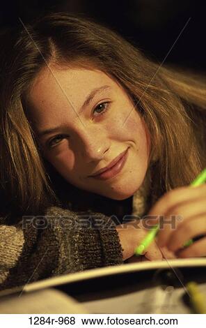 Stock Photo - people, writing, brunette, indoors, teenager. Fotosearch