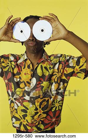 people, yellow, humorous, CD, compact disc, indoors View Large Photo Image Stock Image - people, yellow, humorous, CD, compact disc, indoors. Fotosearch