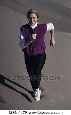 sand, people, running, woman, outdoors, sports View Large Photo Image Stock Photo - sand, people, running, woman, outdoors, sports. Fotosearch