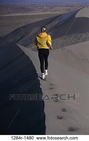 sand, people, running, woman, sand dune, outdoors, sports View Large Photo Image Stock Image - sand, people, running, woman, sand dune, outdoors, sports. Fotosearch
