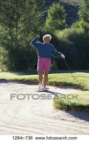 sand, people, woman, golf, excited, senior, outdoors View Large Photo Image Stock Photograph - sand, people, woman, golf, excited, senior, outdoors. Fotosearch