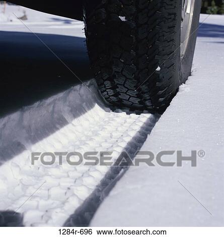Stock Photograph - snow, car, winter, weather, tire. Fotosearch