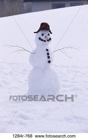Stock Photo - snow, smiling, hat, winter, Christmas, cold, coal. Fotosearch