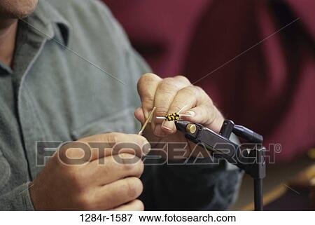 sports, fishing, repair, fixing, fly fishing, repairing View Large Photo Image Stock Photo - sports, fishing, repair, fixing, fly fishing, repairing. Fotosearch
