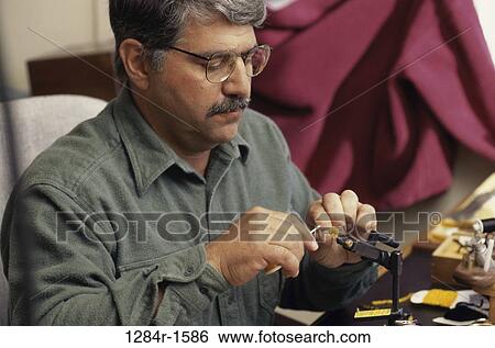 sports, Middle-aged, fishing, repair, fixing View Large Photo Image Stock Photograph - sports, Middle-aged, fishing, repair, fixing. Fotosearch