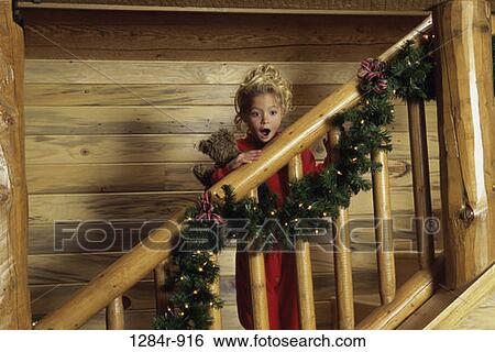 Stock Photograph - stairs, Christmas, girl, child, surprise, blond. Fotosearch