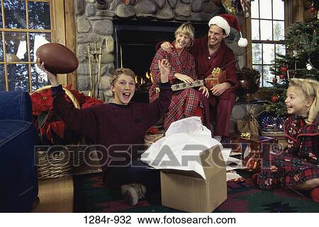 Stock Image - stone, Christmas, football, fireplace, joyous, family. Fotosearch