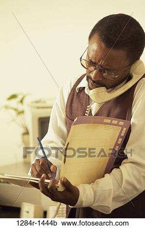 Stock Image - telephone, talking, eyeglasses, busy, phone, folder. Fotosearch