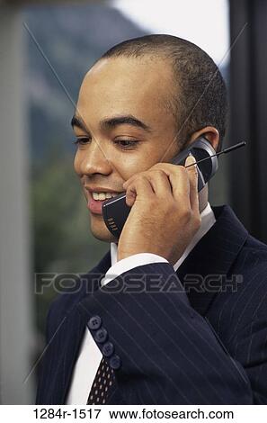 Stock Photo - telephone, talking, phone, business, outdoors, cell phone. Fotosearch